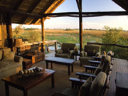 The view from the lounge at Duba Plains in the Okavango Delta, Botswana overlooks fertile floodplains in front of the camp.