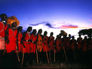 A group of Maasai gather as the sun goes down in Tanzania.
