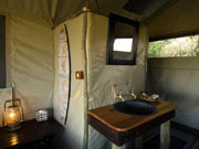 The en-suite bathrooms of Discoverer mobile safari tents include hot and cold water taps.