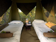 The simple but comfortable interior of an Adventurer mobile safari tent.